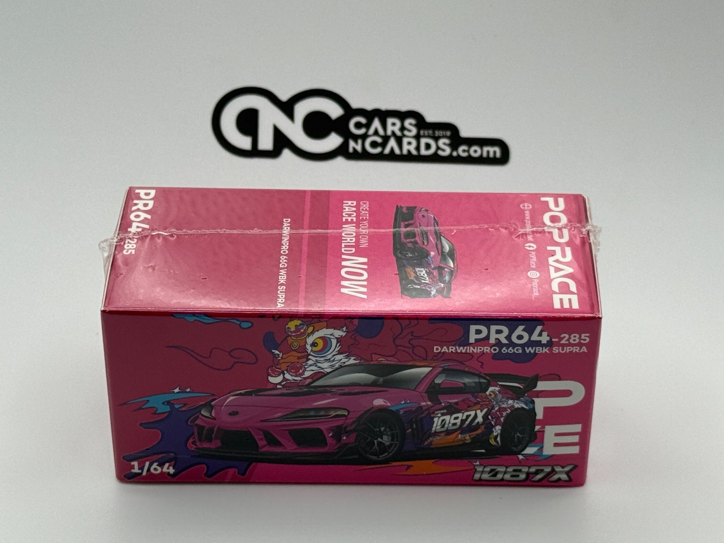 POPRACE 1:64 DARWIN PRO 66G WBK SUPRA (A90) - 1087X LION DANCE PR640