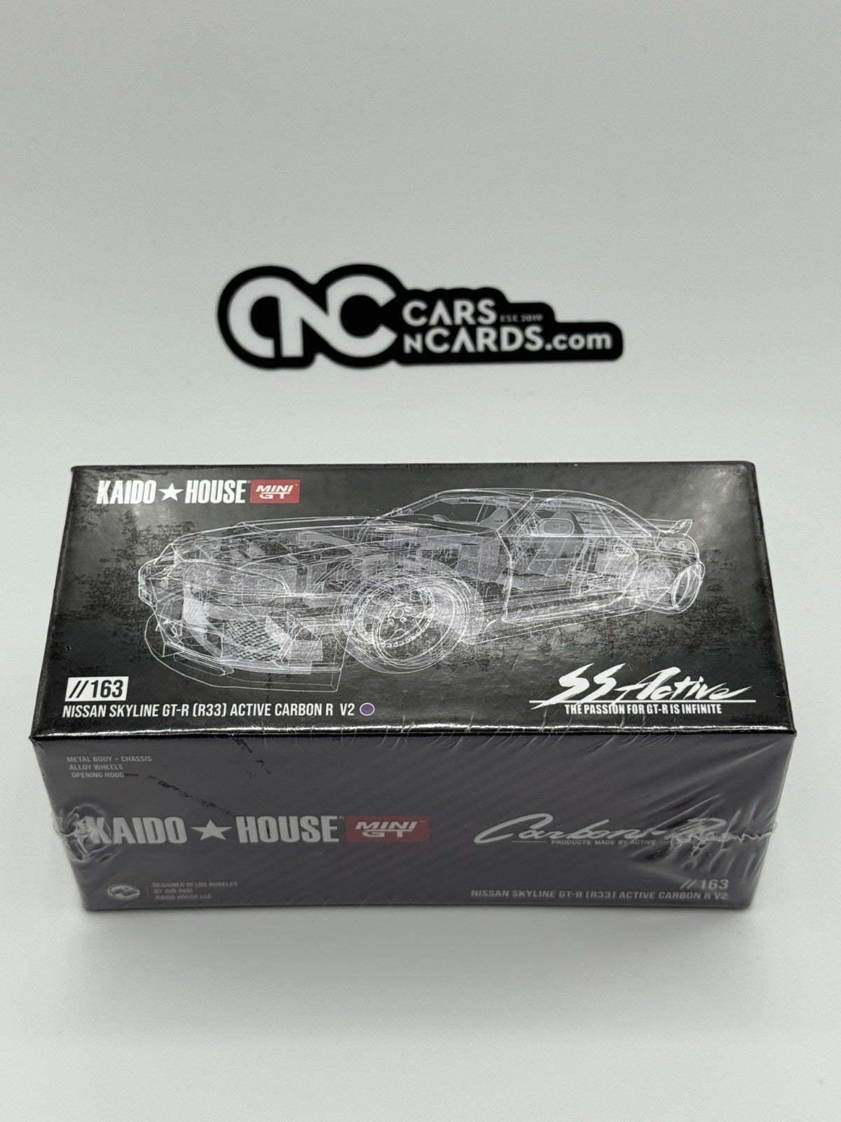 Kaido House x Mini GT 1:64 Nissan Skyline GT-R (R33) Active Carbon R Sealed