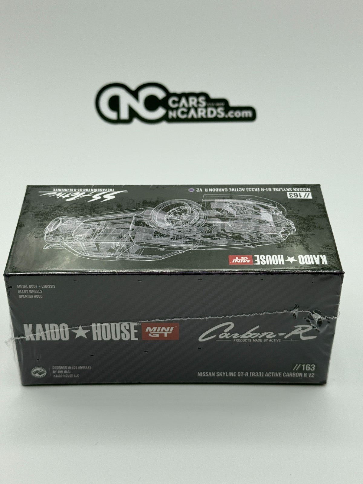 Kaido House x Mini GT 1:64 Nissan Skyline GT-R (R33) Active Carbon R Sealed