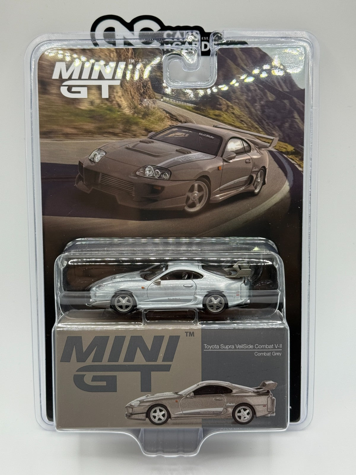 Mini GT 1:64 Toyota Supra VeilSide Combat V-II – Combat Grey Sealed Raw Chase