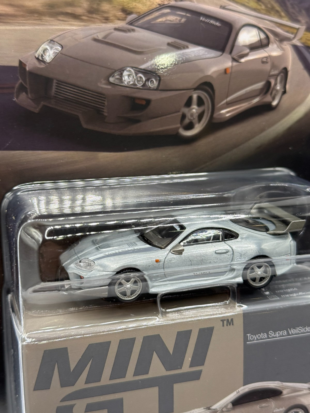 Mini GT 1:64 Toyota Supra VeilSide Combat V-II – Combat Grey Sealed Raw Chase