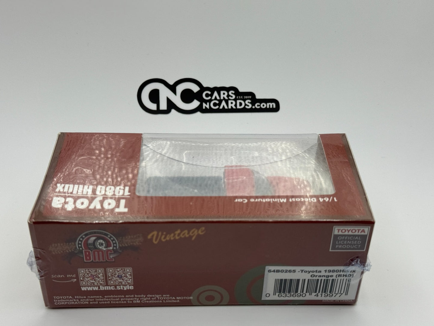 BMC 1:64 Toyota 1983 Hilux N60, N70 Orange RHD
