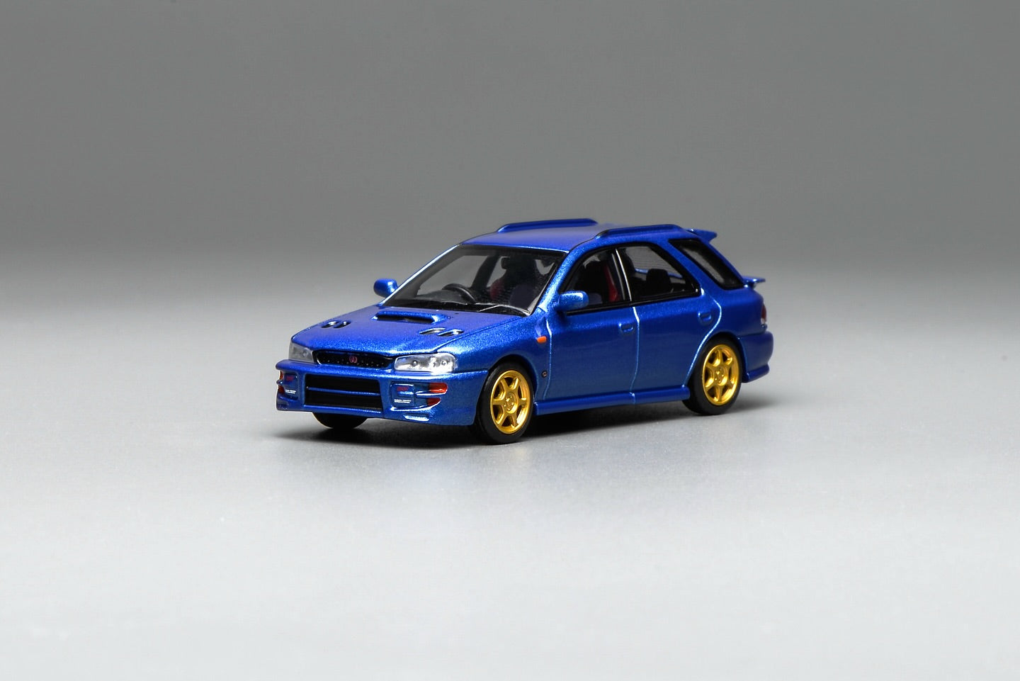 (PRE-ORDER) Motorhelix 1:64 Subaru Impreza Wagon WRX STi Version VI (GC8) Customized World Rally Blue Mica M67101