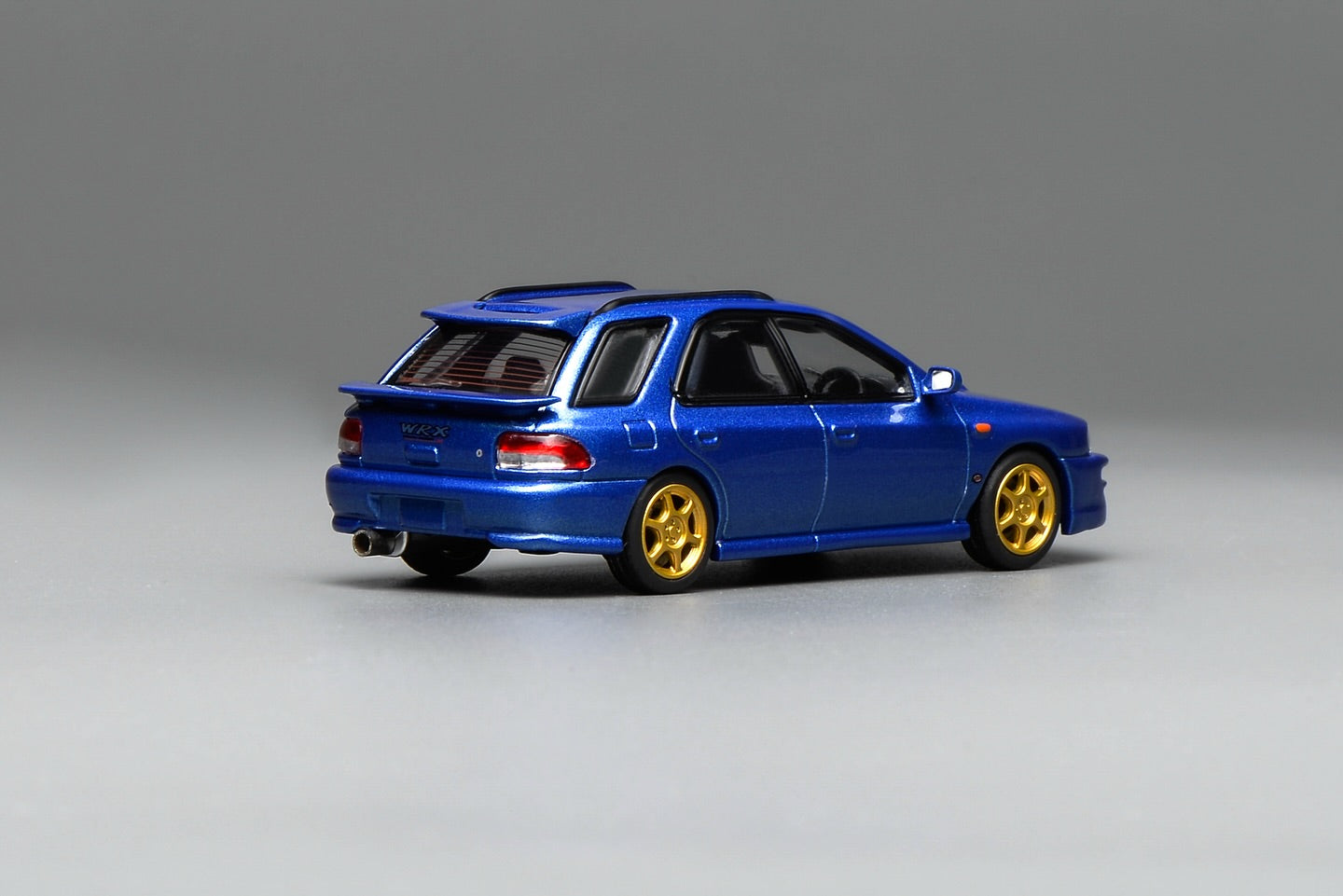 (PRE-ORDER) Motorhelix 1:64 Subaru Impreza Wagon WRX STi Version VI (GC8) Customized World Rally Blue Mica M67101