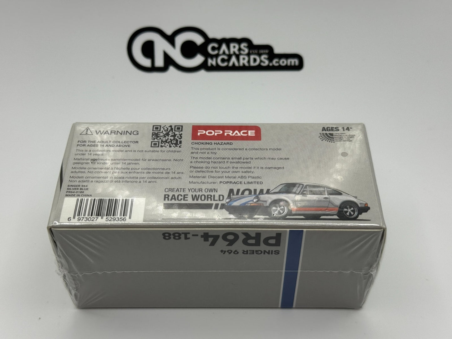 POPRACE 1:64 SINGER 964 SILVER/BLUE PR640188