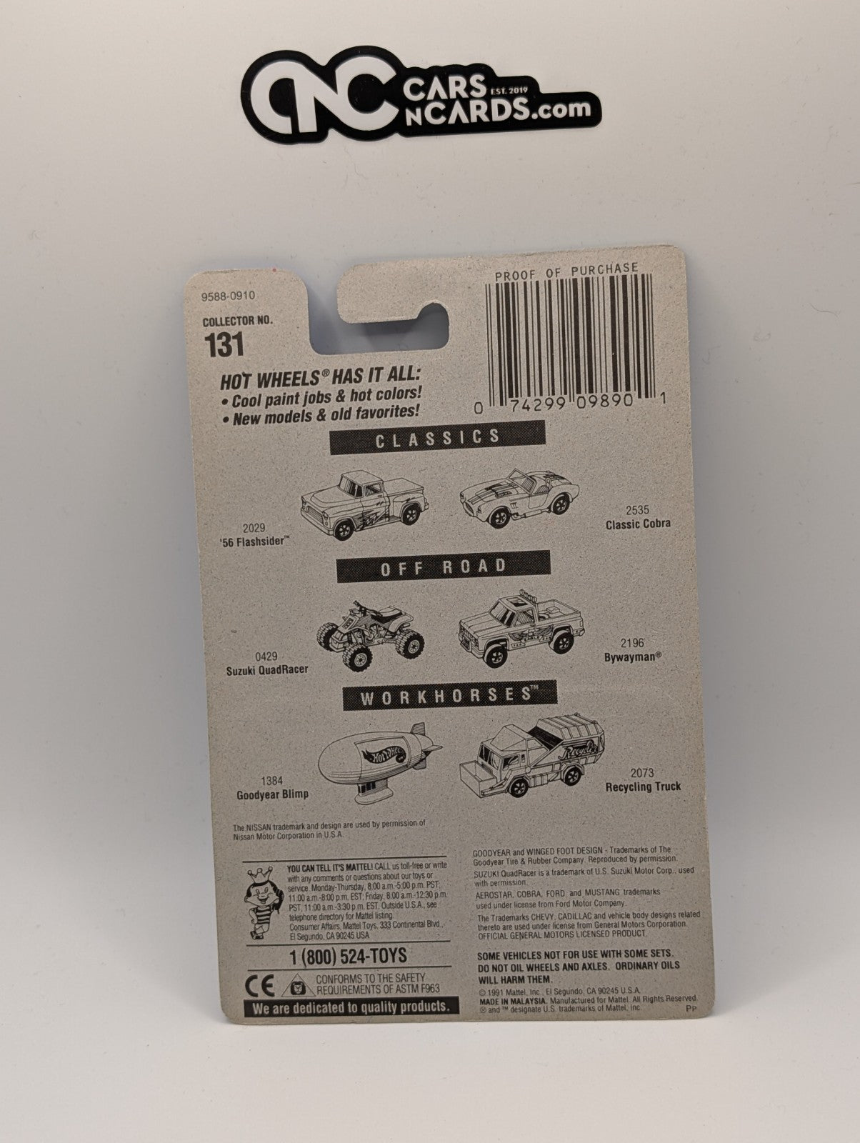 1991 Hot Wheels Nissan Hardbody Black Green & Blue Collector #131 (Card Crease)