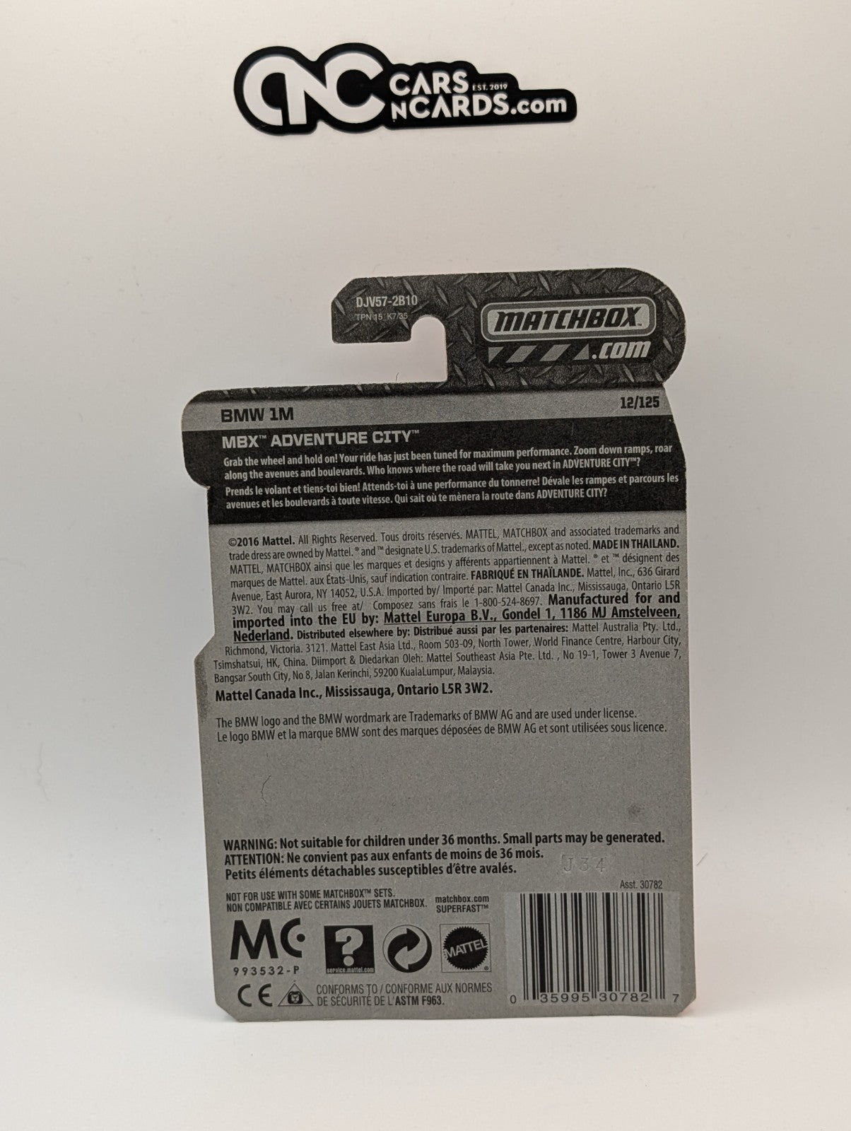 Matchbox MBX Adventure City BMW 1M Gold 12/125 (Card Damage)