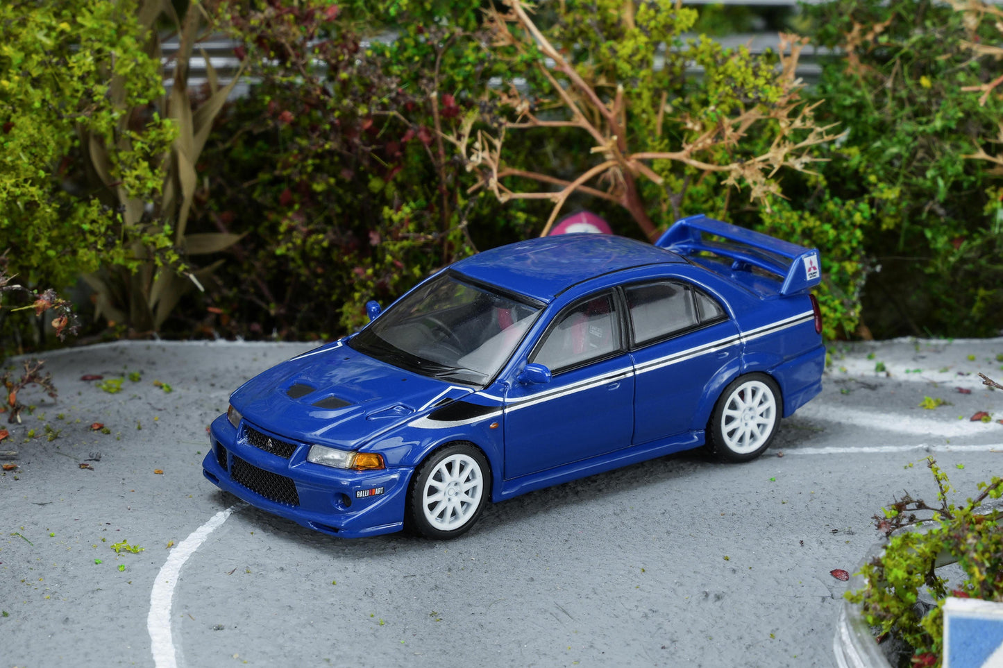 (PRE-ORDER) Motorhelix 1:64 Mitsubishi Lancer Evolution VI GSR T.M.E Ice Blue with livery M64302