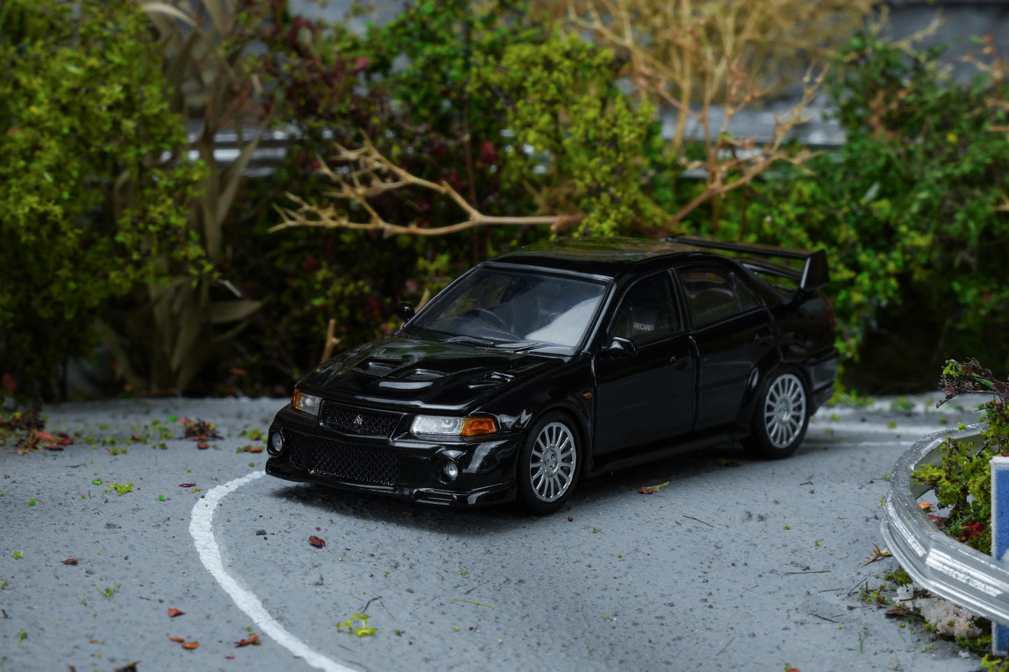 (PRE-ORDER) Motorhelix 1:64 Mitsubishi Lancer Evolution VI GSR Pyrenean Pearl Black M64201