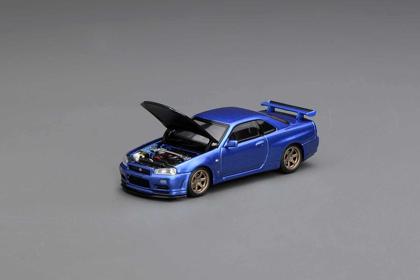 (PRE-ORDER) Motorhelix 1:64 NISSAN SKYLINE GT-R (R34) V-SPEC II CUSTOMIZED BAYSIDE BLUE W/ CARBON FIBER BONNET M63451