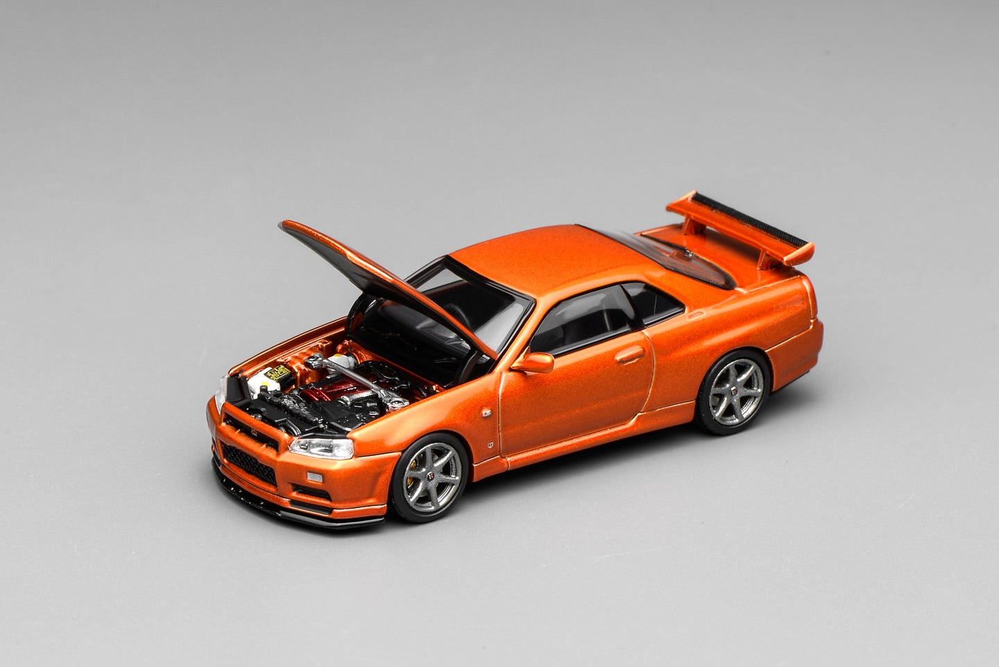 (PRE-ORDER) Motorhelix 1:64 Nissan Skyline GT-R (R34) V-Spec II Customized Metallic Orange M63471