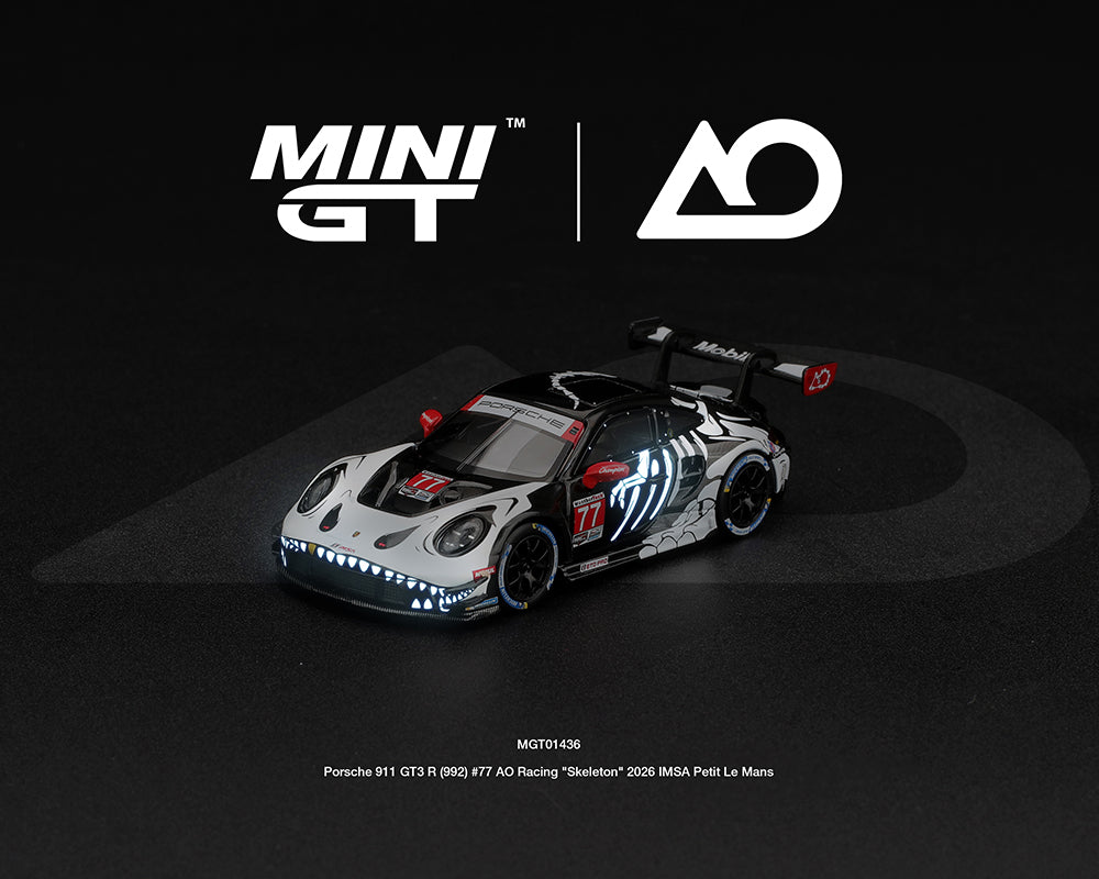 (PRE-ORDER) Mini GT - Porsche 911 GT3 R (992) #77 AO Racing “Skeleton Rexy” 2026 IMSA Petit Le Mans – (Glow in the Dark) – Limited Edition MGT01436-BL